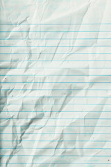 Obraz premium Close-up of a textured blue crumpled paper background, highlighting soft shadows and intricate light reflections.