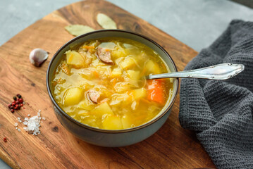 Kapusniak, traditional Polish sauerkraut soup with potatoes and carrots