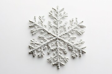 Sparkling snowflake on white background, winter concept.