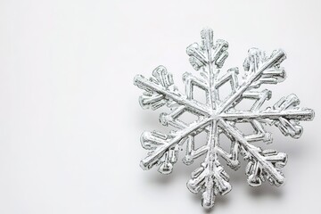 Silver snowflake on white background, holiday theme