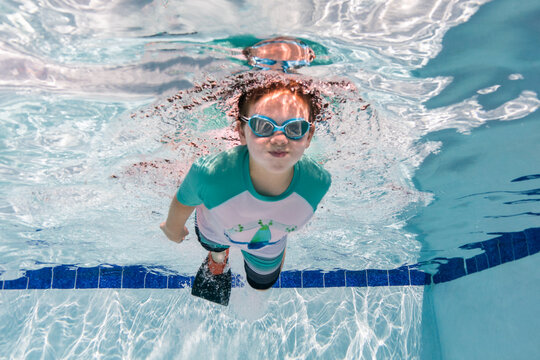 Boy playing underwater in a pool 
