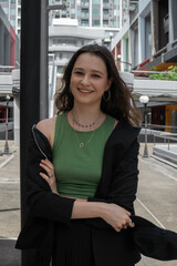 Beautiful girl dancing modern choreography on the street