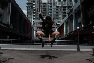 Beautiful girl dancing modern choreography on the street
