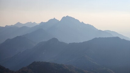 fog in the mountains. Smoky cloudy mountains And trees. Bukhansan National Park, South Korea. Hiking Mountains in Korea