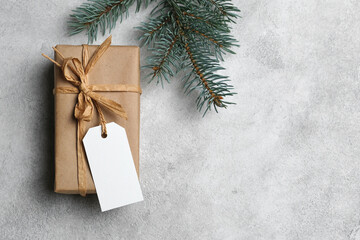 Christmas gift box with blank gift tag mockup with copy space, white tag card with space for text or design