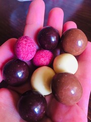 Colored candies in the palm of your hand
