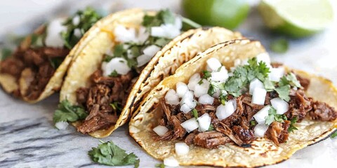 Delicious homemade carne asada street tacos topped with cheese, cilantro, and onion create a mouthwatering experience. Enjoy these carne asada street tacos for a flavorful treat.