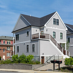 Newly built two-story family home with cross-gable roof in Brighton, Massachusetts, USA