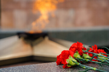 The Victory Monument and the eternal flame with carnations, a symbol of victory over fascism and...