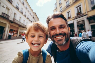Obraz premium Close up of a father and his son taking selfie while walking in the city