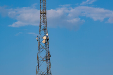 The communication tower of the mobile operator. View of the telecommunication equipment and...