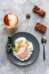  Traditional Scandinavian-style rice porridge, pudding in Christmas style with decoration, close up, top view