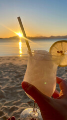 Frozen drink at the beach at sunset