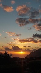 Obraz premium Sky, clouds, orange, yellow, blue, nature, outdoor, outside, island, beach, coastline, coast, landscape, rock, mountain, cliff, relax, peace, paradise, madeira island, island, tree