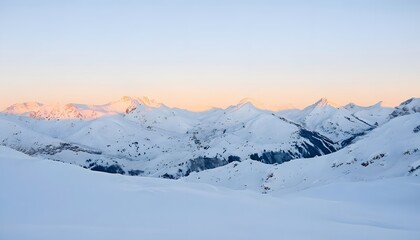 Snow-Covered Mountains with a Sunrise Glow