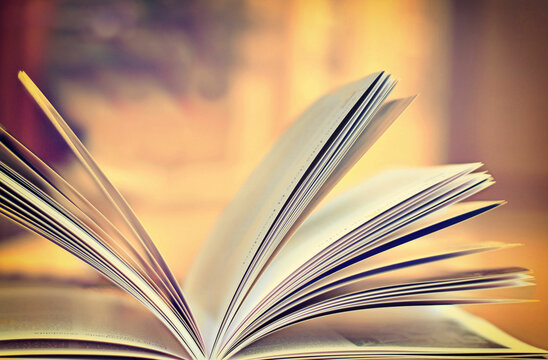 Close-up of an open book lying on a table
