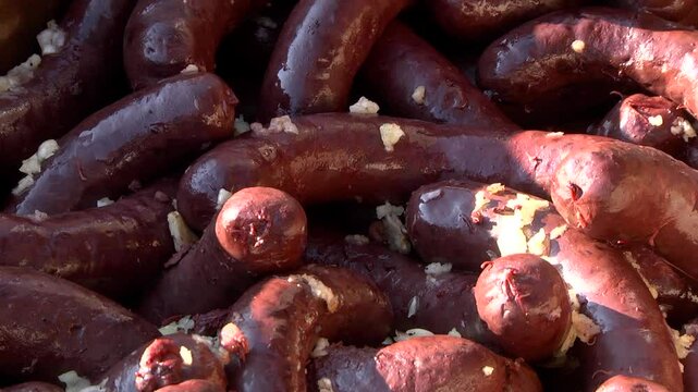 Blood sausages are lying on the counter in the store.