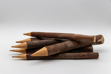 Rustic Wooden Pencils Crafted from Natural Branches in an Artistic Display