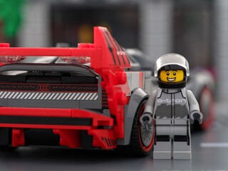 Obraz premium Tambov, Russian Federation - June 24, 2024 Lego Audi S1 E-tron Quattro car driver near the back of his car. LEGO Speed Champions