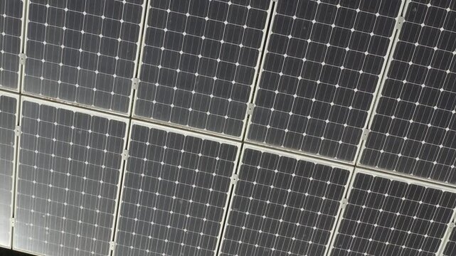 aerial 4k drone view of photovoltaic solar panel energy technology field