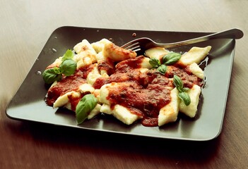 meat goulash with noodles and vegetables as dinner dish