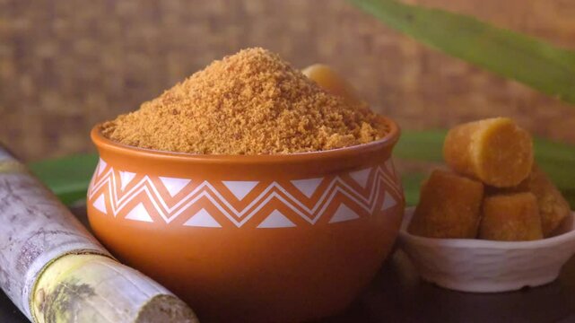 Jaggery powder with jaggery cubes. Jaggery is used as an ingredient in sweet and savoury dishes in the cuisines of India.