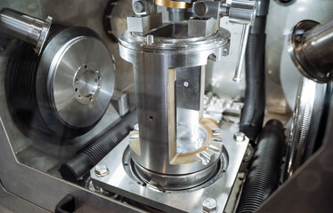 This image provides a closeup of a motorcycle engine, highlighting its intricate components and unique design features with stunning clarity, showcasing fine craftsmanship