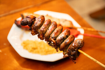 chicken heart skewer in close-up with blurred background in steakhouse