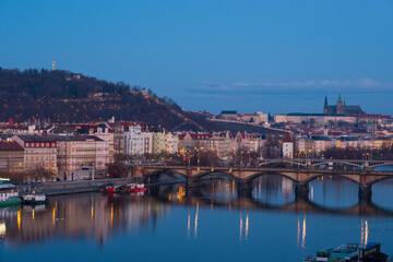 Prague, Czech Republic. Jiraskuv Bridge over Vltava river in Prague, Czech Republic. The sunrise with Castle.