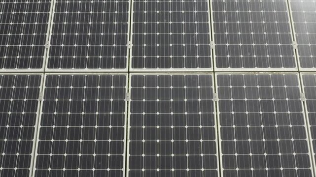aerial 4k drone view of photovoltaic solar panel energy technology field