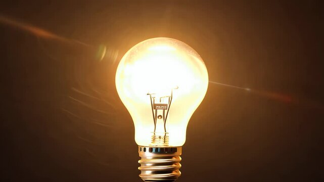 light bulb olated black background flickers off casting warm bright glow looped video 4K captures vintage nostalgic feel old style ideal retro steampunk lighting themed visuals
