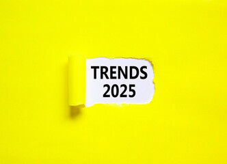 Planning trends 2025 new year symbol. Concept words Trends 2025 on beautiful white paper. Beautiful yellow paper background. Business trends 2025 new year concept. Copy space.
