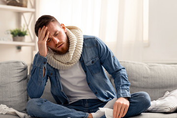 Respiratory epidemic. Sick man with fever suffering at home alone, free space