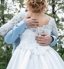 bride and groom in the park