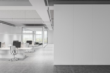 Spacious modern office with white desks and blank wall partition, featuring large windows. Interior design concept. 3D Rendering
