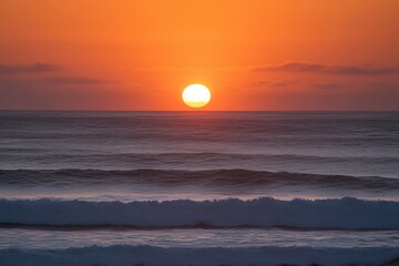 The sun sets beautifully over the ocean, casting warm hues across the waves and illuminating the tranquil beach at dusk. Generative AI