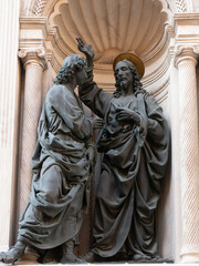 The statuary group of the Incredulity of Saint Thomas 1467-1483 by Andrea del Verrocchio in the external niches of the church of Orsanmichele in Florence, Italy.