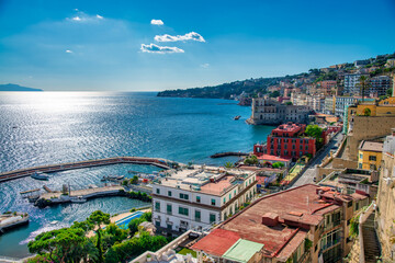 Beautiful Mergellina waterfront at dusk with boats and stunning skyline in the background