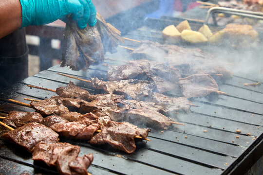 Anticuchos are typically grilled over an open flame, giving the meat a slightly charred and smoky flavor. They are often cooked to perfection, achieving a tender and juicy texture.