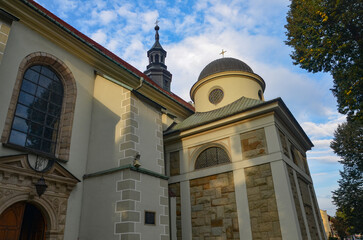 Cathedral of the Nativity of the Blessed Virgin Mary in Żywiec – a temple built in the fifteenth century with a high tower with a clock on it © Pawel Filusz