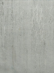 Fototapeta premium Close up view of a textured concrete wall with subtle patterns during daylight hours