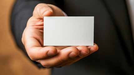 Businessperson holding a blank card for presentation or networking purpose