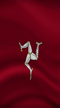 Isle of Man Waving Flag in Vertical Orientation. Realistic Flag Animation. Seamless Loop Background.