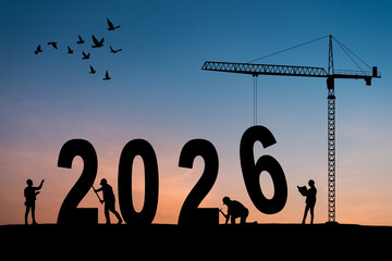 2026 New Year for planning and strategies concept. Silhouette of a construction crane against blue...