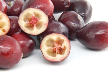 Close-Up of Fresh Red Cranberries on White Background