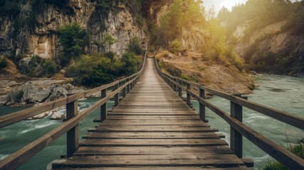 Wooden Bridge Over River: A rustic wooden bridge gracefully spans a pristine, turquoise river, nestled between towering cliffs, bathed in the soft, golden light of sunrise.