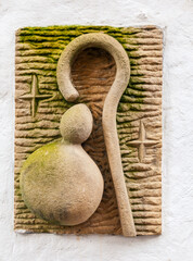 Celtic-inspired stone carving of a pilgrim's staff along the Camino de Santiago route