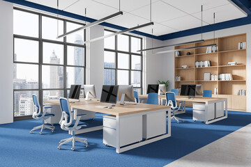 Modern open-plan office with workstations and large windows with city view in bright coworking space. 3D Rendering
