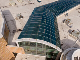 Daytime Drone Images of a Large Commercial TPO Roof With Unique Skylights and an Atrium