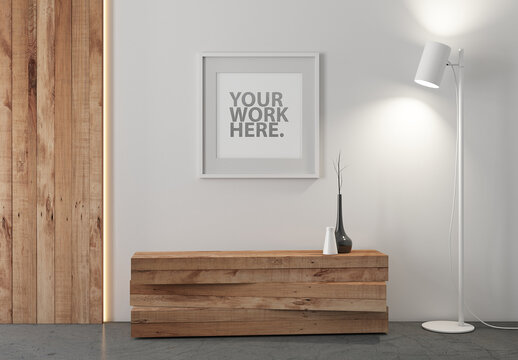 Square poster in white frame mockup with passepartout hanging on wall in room